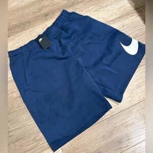 Blue Nike fleece shorts .
